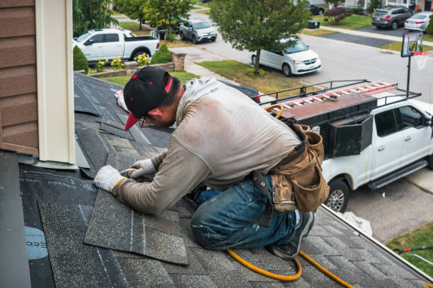 Professional Roofing technician working in Lansing, MI